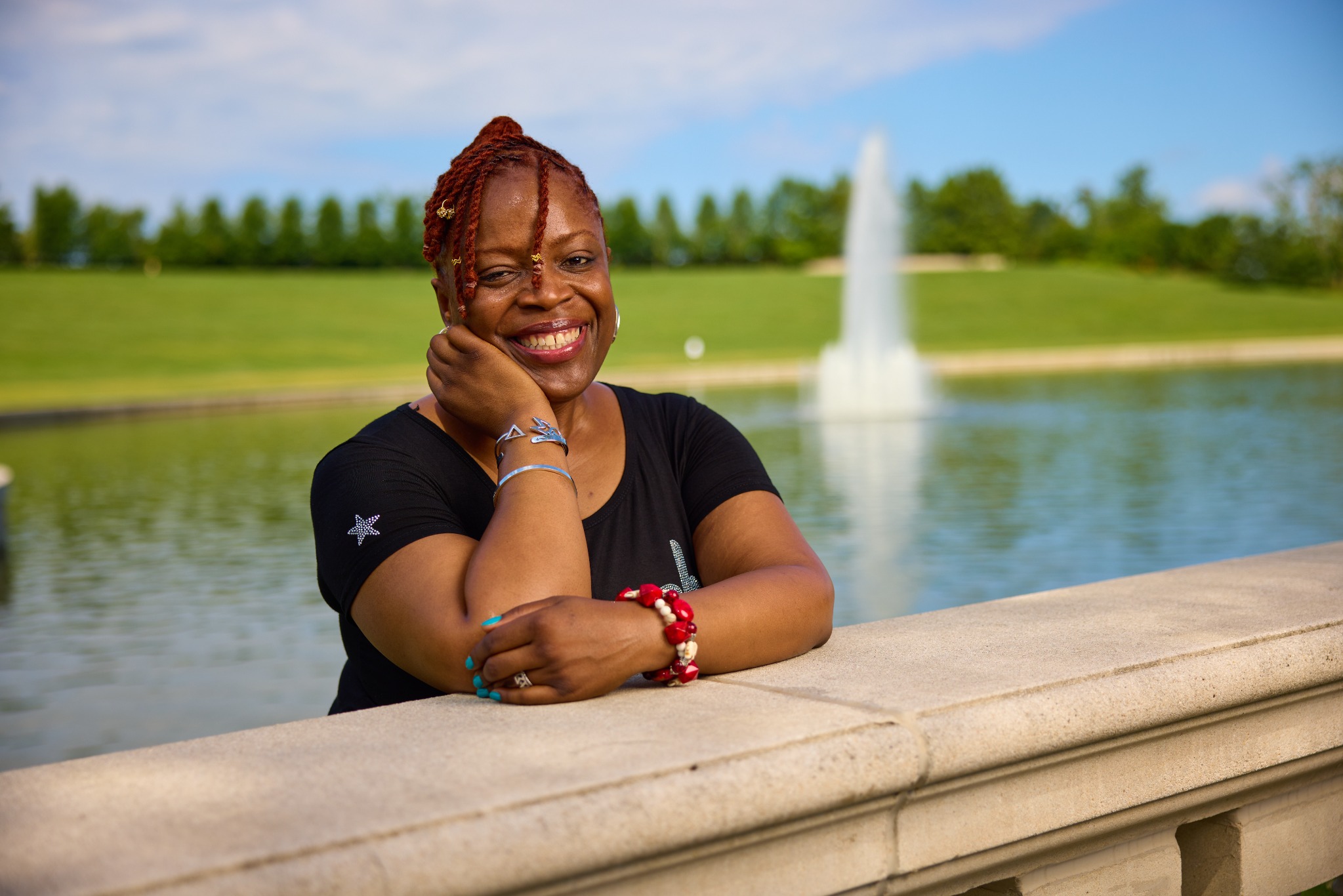 Janelle Renee Jenkins by a reflecting pool